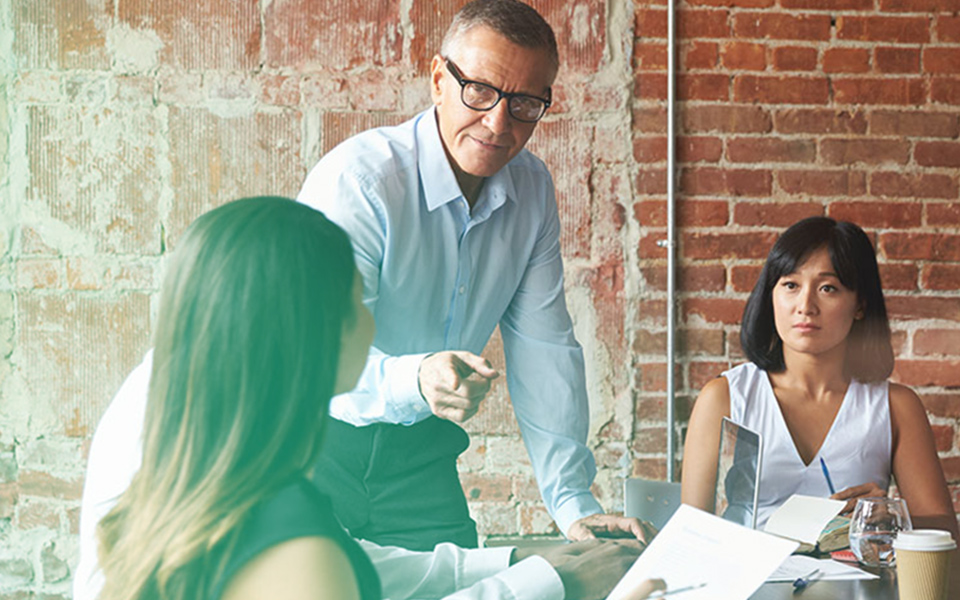 Image of three business people brainstorming new concepts - representing how Mier Human Capital came to be and how they help other businesses